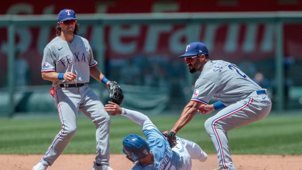 Jun 29, 2022; Kansas City, Missouri, USA; Kansas City Royals second baseman Whit Merrifield (15) is tagged out at second base by Texas Rangers second baseman Marcus Semien (2) during the fifth inning at Kauffman Stadium. Mandatory Credit: William Purnell-USA TODAY Sports